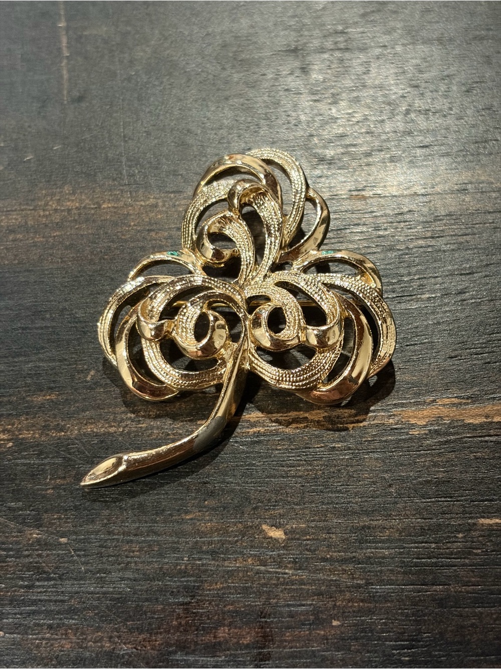 Gold tone clover brooch